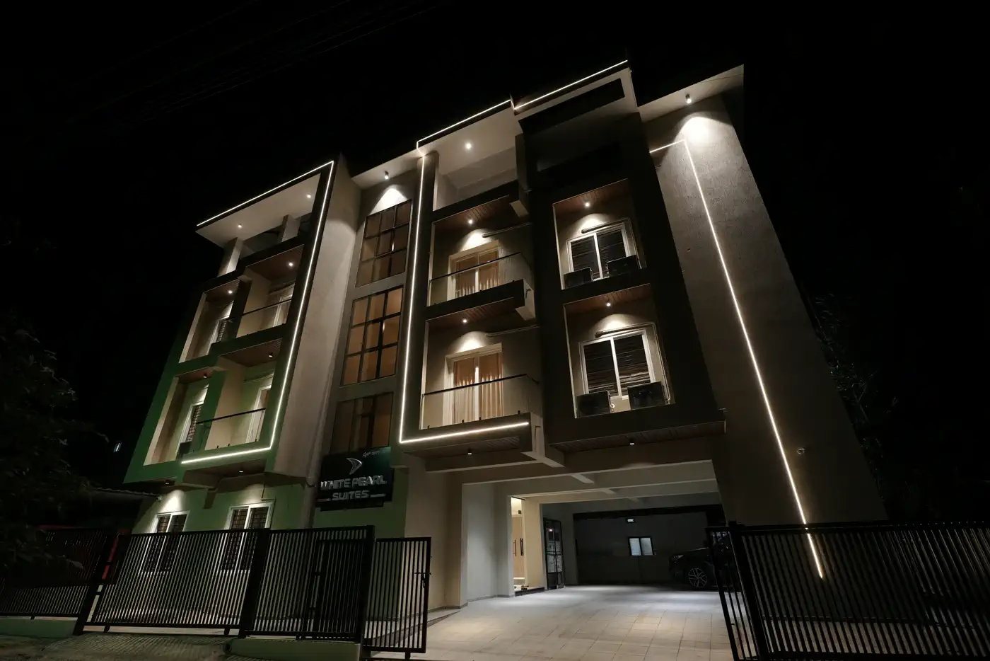 White Pearl Suites exterior at night